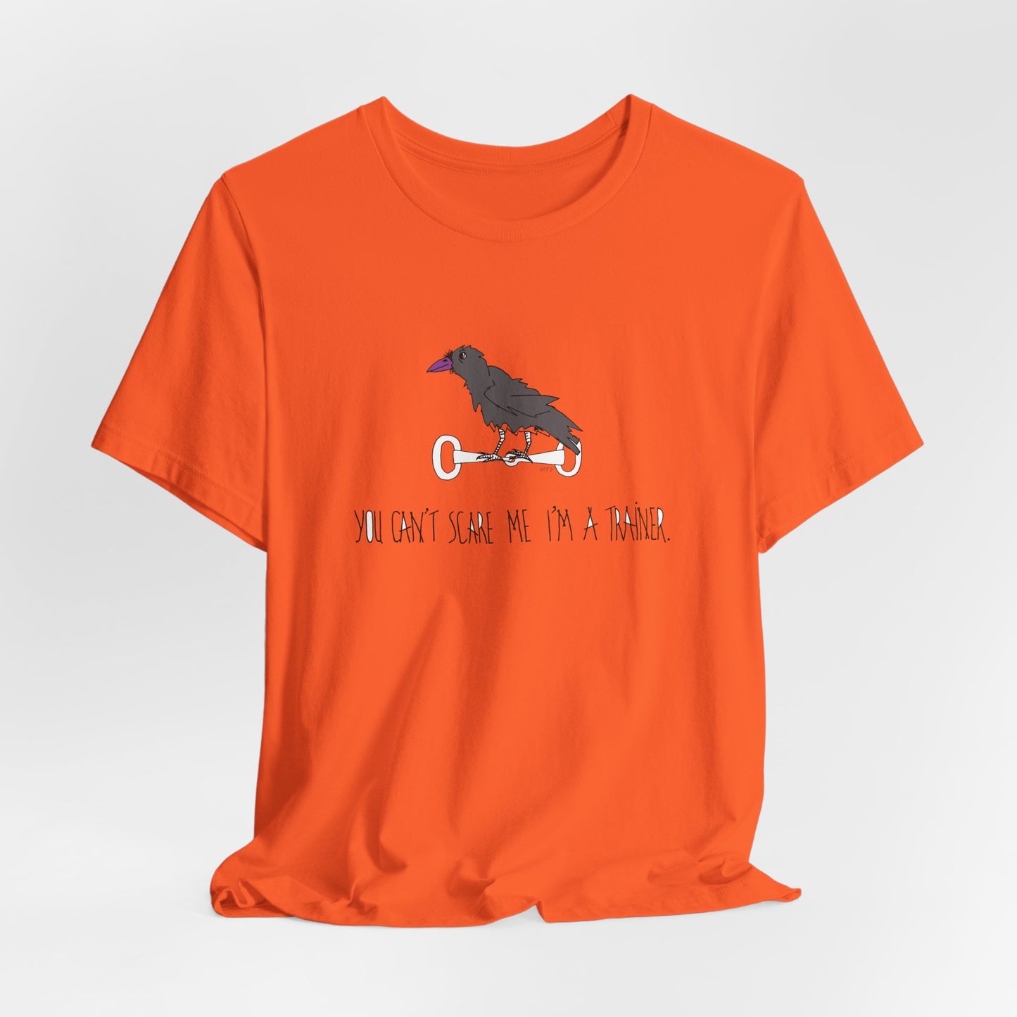 Halloween Equestrian Trainer Special. Crow on a snaffle bit. "You can't scare me I'm a trainer" - Unisex Jersey Short Sleeve Cotton Tee by artist Marie Frederique