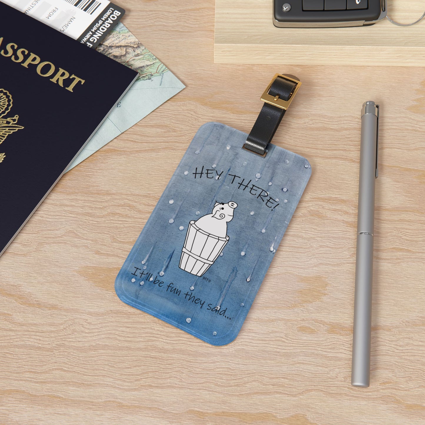 Luggage Tag with leather strap, Mr. Pig - It'll be fun they said... on a blue wet look background by artist Marie Frederique