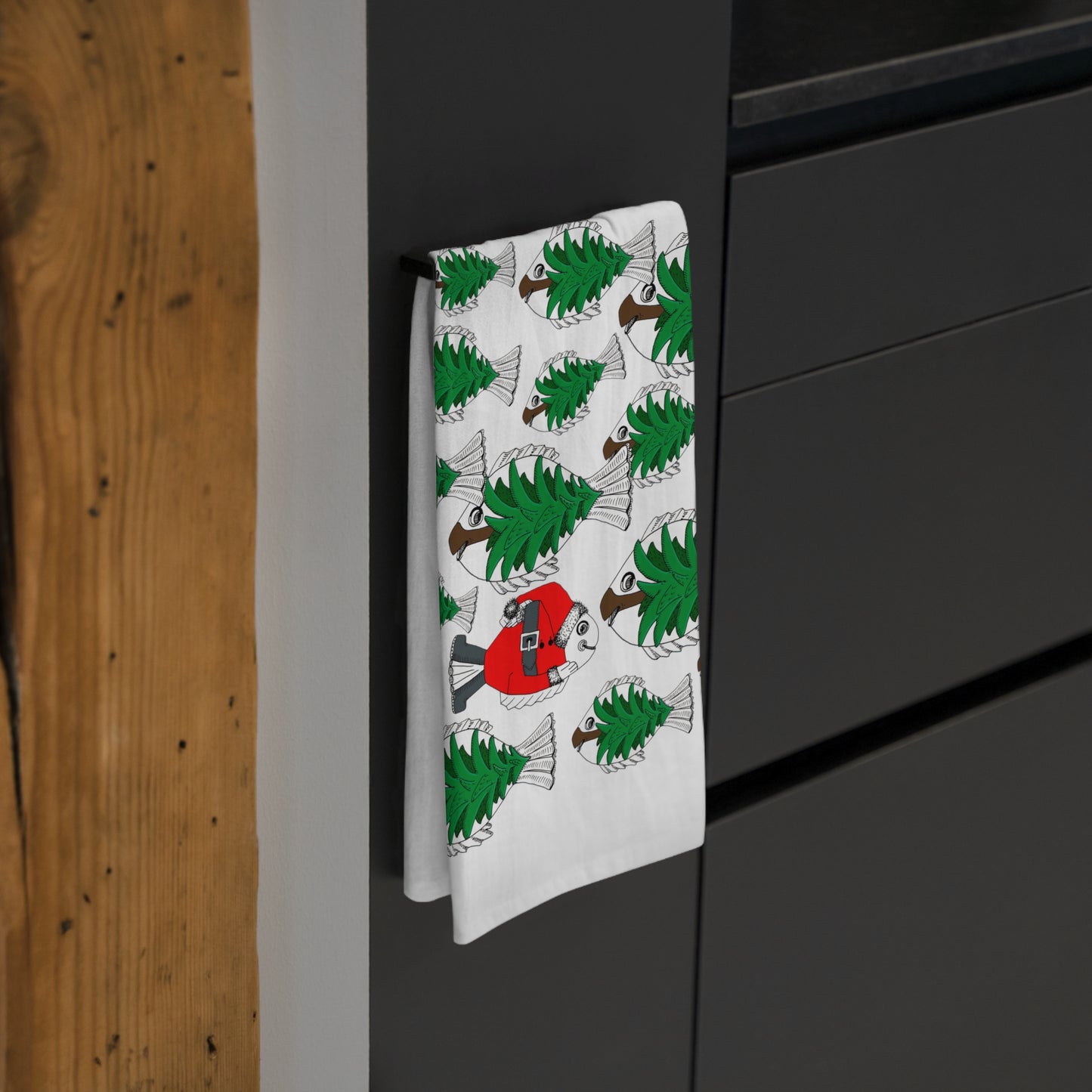 Christmas Tea Towel/Kitchen towel. Shoal of Green Pine Tree Fish with a Red Santa Fish - by artist Marie Frederique