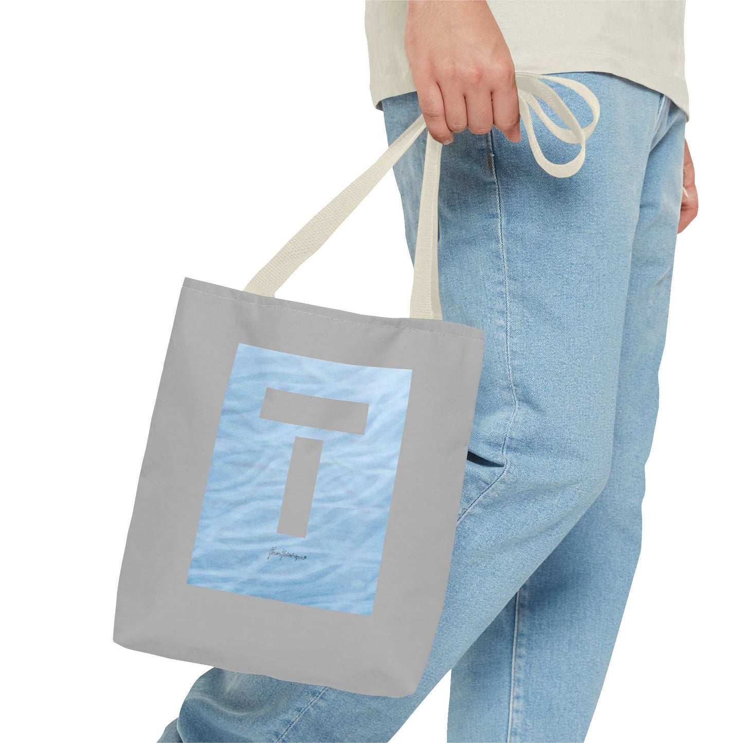 T symbol, Star Energy with light blue water reflections, Grey Tote Bag with beige handles by artist Marie Frederique