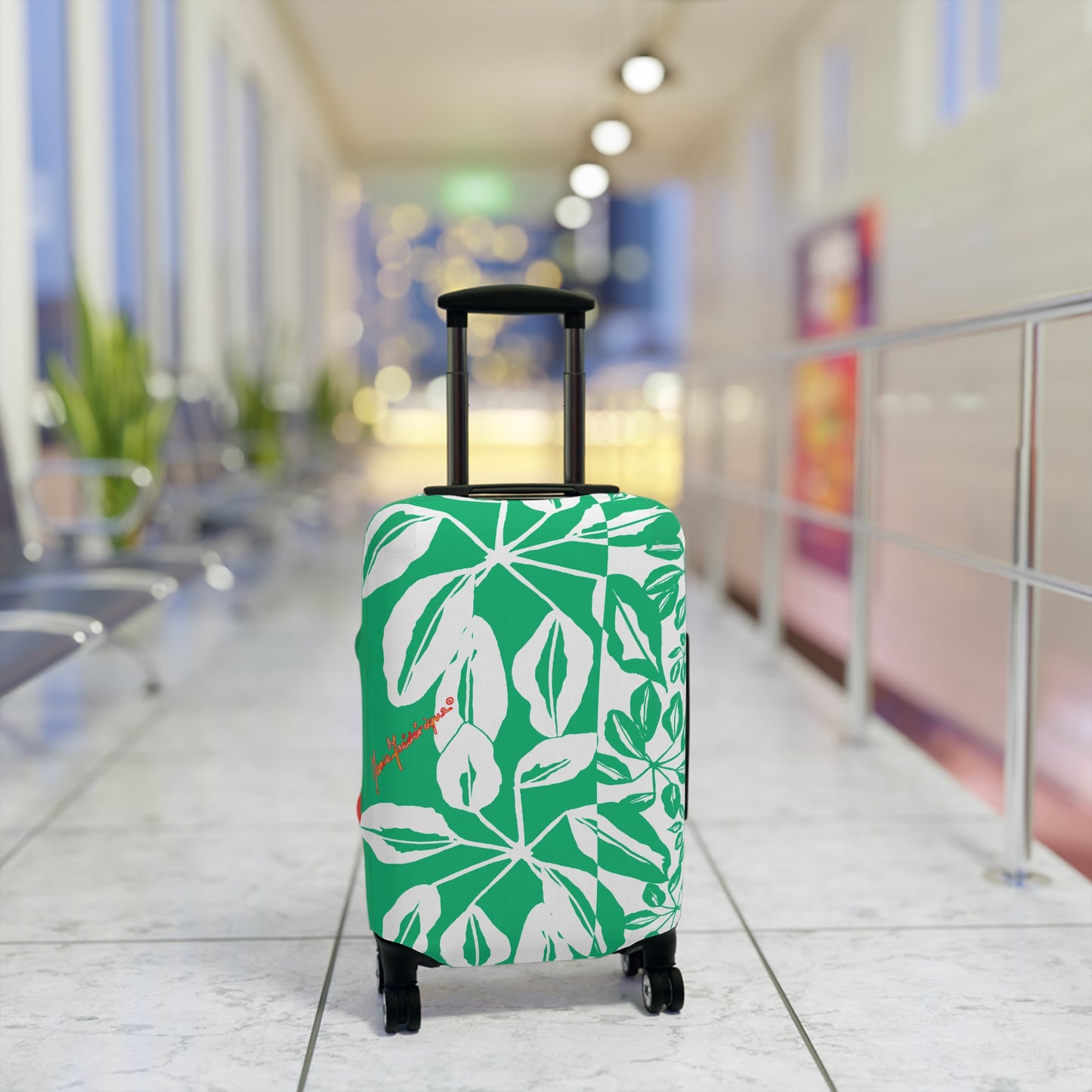 Luggage Cover, Tropical leaves in Green and White by artist Marie Frederique