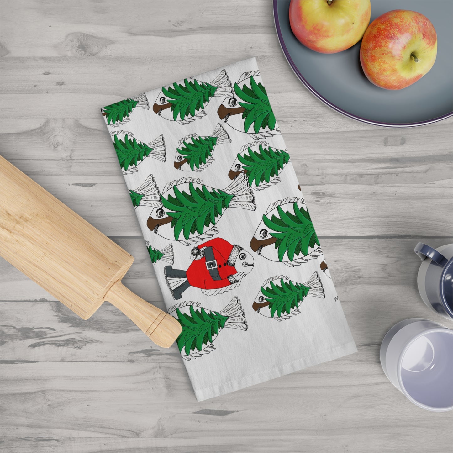 Christmas Tea Towel/Kitchen towel. Shoal of Green Pine Tree Fish with a Red Santa Fish - by artist Marie Frederique