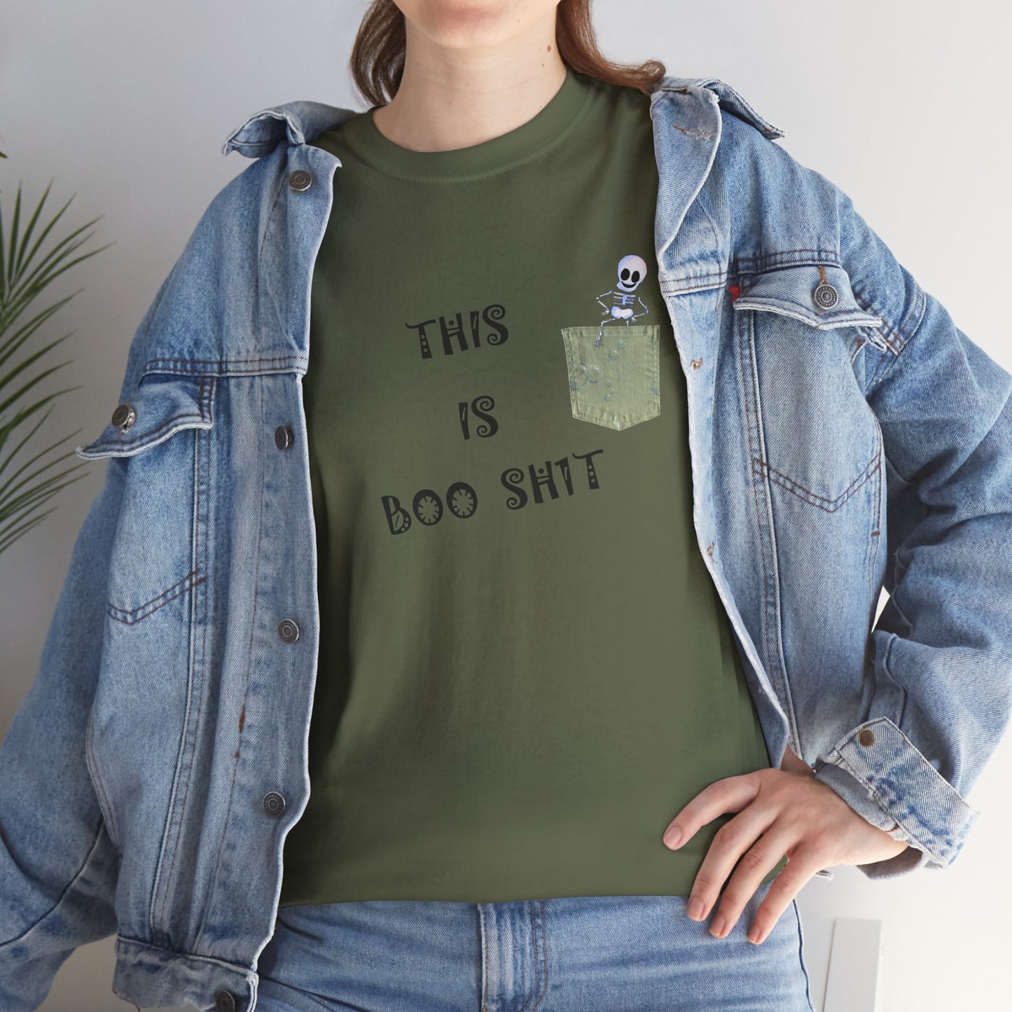 Halloween "THIS IS BOO SH1T" - with a skeleton climbing out of a false pocket, Unisex Heavy Cotton Tee by artist Marie Frederique